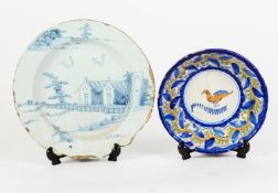 18th CENTURY ENGLISH DELFT PLATE, in blue with houses in a landscape, (badly chipped with