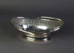EDWARDIAN SILVER OVAL SWING HANDLED CAKE BASKET, with Adams style cut card pierced and engraved