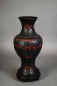 CHINESE CINNABAR LACQUERED VASE, of baluster form, well carved with figures, dwellings and trees