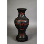 CHINESE CINNABAR LACQUERED VASE, of baluster form, well carved with figures, dwellings and trees