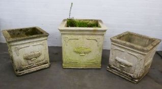 SUITE OF THREE RECONSTITUTED STONE CLASSICALS STYLE SQUARE GARDEN VASES, the exteriors embossed to