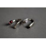 TWO GEORG JENSEN 18ct WHITE GOLD TORQUE PATTERN RINGS, each ring with terminals set with a 1/2ct