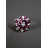 ATTRACTIVE WHITE GOLD/PLATINUM (unmarked) DIAMOND and RUBY SET CLUSTER RING, the central brilliant