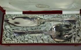 CASED PAIR OF CHRISTOFLE, FRENCH ELECTROPLATED FISH SERVERS, with double struck scroll decorated