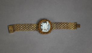 GILT FILIGREE COSTUME BRACELET, with centre oval cameo