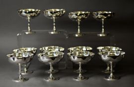 SET OF TWELVE ELECTROPLATED SUNDAE DISHES, each with pinched rim, beaded knopped stem and conforming