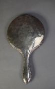 SILVER BACKED LADY?S HAND MIRROR, floral engraved and with scroll embossed border and circular,