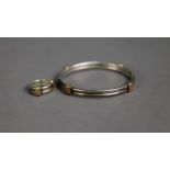 SILVER HINGE-OPENING BANGLE of two strand wire pattern with gold triple wire pattern binding
