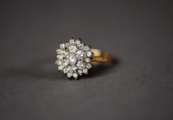 18ct GOLD AND DIAMOND THREE TIER CLUSTER RING, with raised centre diamond, approximately .20ct,