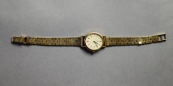 LADY'S OMEGA 9ct GOLD WRISTWATCH, with mechanical movement, the oval dial with batons, the winding