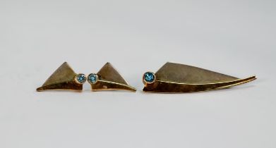 SILVER AND PARCEL GILT SAIL SHAPED BROOCH, collet set with a blue topaz, 2in (5cm) long and the pair