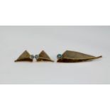 SILVER AND PARCEL GILT SAIL SHAPED BROOCH, collet set with a blue topaz, 2in (5cm) long and the pair