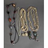 FOUR IMITATION PEARL NECKLACES and a pair of clip earrings; a PAIR OF LARGE BRONZED METAL AND