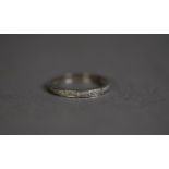 18ct WHITE GOLD ETERNITY RING set with approximately 16 tiny diamonds, ring size O, 2.6gms