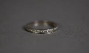 18ct WHITE GOLD ETERNITY RING set with approximately 16 tiny diamonds, ring size O, 2.6gms