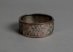 VICTORIAN SILVER COLOURED METAL BROAD HINGE-OPENNG BANGLE, the top bright cut engraved and having