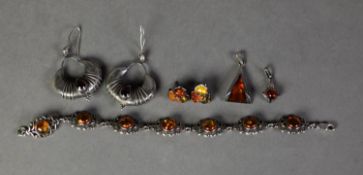 SILVER JEWELLERY set with cabochon amber coloured translucent stones, viz a pair of EARRINGS, horn