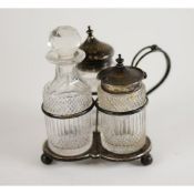 GEORGE V SILVER MOUNTED AND CUT GLASS CONDIMENT TRIO, on trefoil silver stand with wire pattern