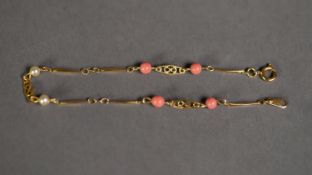 18k GOLD BRACELET, the links punctuated with four coral beads and two seed pearls, 1.8 gms gross