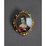PAINTED PORTRAIT MINIATURE OF A LADY in décolleté dress, oval, in a gold coloured metal narrow frame
