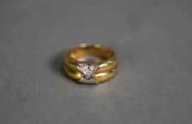 18ct YELLOW AND WHITE GOLD TWO STRAND RING, the ?V? shaped overlapping top set with three tiny white