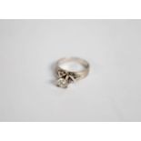 18ct WHITE MATT GOLD RING with broad flat shank with a round brilliant cut solitaire diamond in a