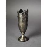 GEORGE V WEIGHTED SILVER VASE of panelled form with shell and pendant capped wavy border and moulded