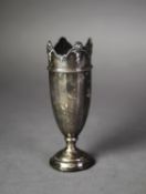 GEORGE V WEIGHTED SILVER VASE of panelled form with shell and pendant capped wavy border and moulded