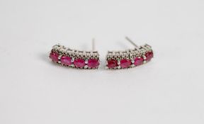 PAIR OF WHITE GOLD (unmarked) RUBY AND DIAMOND EARRINGS for pierced ears, each earring slightly