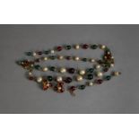 COSTUME NECKLACE, gilt metal with imitation pearls and red and green glass beads, triple strand