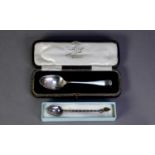GEORGE V SILVER CASED CHILD?S SPOON, Sheffield 1925, together with a FOREIGN SILVER COLOURE METAL (