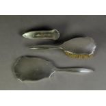 THREE PIECE ENGINE TURNED SILVER BACKED DRESSING TABLE HAND MIRROR AND BRUSH SET, comprising: HAND