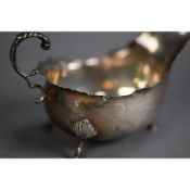 GEORGIAN STYLE SILVER SAUCE BOAT, of typical form with leaf capped flying scroll handle, cyma border