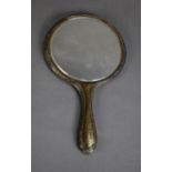 GEORGE V ENGRAVED SILVER BACKED HAND MIRROR, with circular bevel edges plate and moulded wavy