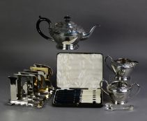 THREE PIECE EMBOSSED ELECTROPLATED TEA SET, of tapering form with foliate scroll border and black