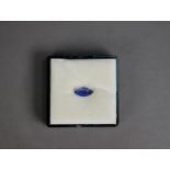 Black plastic sealed vision box containing a MARQUISE SHAPED BLUE GEM STONE