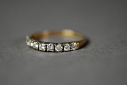 GOLD AND DIAMOND HALF ETERNITY RING set with ten round brilliant cut diamonds, approximately 1/2