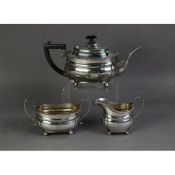 EDWARD VII THREE PIECE SILVER PRESENTATION TEA SET BY PEARCE & SONS, of rounded oblong form with