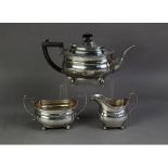 EDWARD VII THREE PIECE SILVER PRESENTATION TEA SET BY PEARCE & SONS, of rounded oblong form with