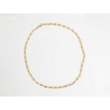 18ct GOLD CHAIN NECKLACE with long and short flattened curb links, 19 1/2in (49.5cm) long, 9.2gms