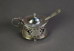 LATE VICTORIAN PIERCED SILVER MUSTARD RECEIVER, of oval form with scroll handle, ball feet and