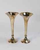 GEORGE V WEIGHTED SILVER PAIR OF TRUMPET VASES BY JAMES DIXON, each with serrated rims to the