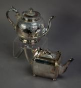 TWO ENGRAVED AND PART FLUTED ELECTROPLATED TEA POTS, one of circular footed form with angular scroll