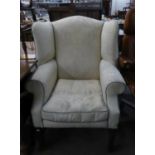 GEORGIAN STYLE WINGED FIRESIDE ARMCHAIR COVERED IN CREAM LEAF EMBOSSED FABRIC, ON MAHOGANY MOULDED