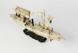 ORIENTAL CARVED BONE MODEL OF A CEREMONIAL BARGE, modelled with hanging lantern and central