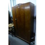 A MAHOGANY SINGLE DOOR HANG WARDROBE, ON BRACKET FEET, 3'6" WIDE