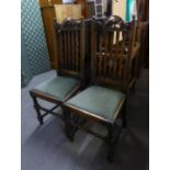 A PAIR OF OAK RAIL BACK DINING CHAIRS, OF JACOBEAN STYLE