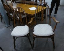 A SET OF EIGHT ELM HOOP BACK DINING CHAIRS, WITH PANEL SEATS, WITH LOOSE SQUAB CUSHIONS, INCLUDING 2