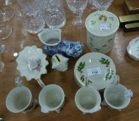 A SET OF FOUR JAPANESE PORCELAIN COFFEE CUPS AND SAUCERS, WITH HOLLY DECORATION; BELLEEK CHINA