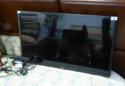 A 32" SAMSUNG FLAT SCREEN TV (NO BASE)